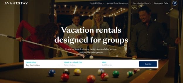 A group of people smiles and plays pool in a stylish, warmly lit room. The screen displays “Vacation rentals designed for groups” with a search bar, highlighting top Vacation Rental Management Companies in Canada.